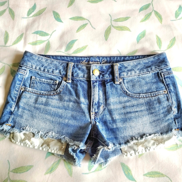 American Eagle High Waist Cut-Off Denim Shorts with Silver Glitter Star Pockets - Picture 1 of 9
